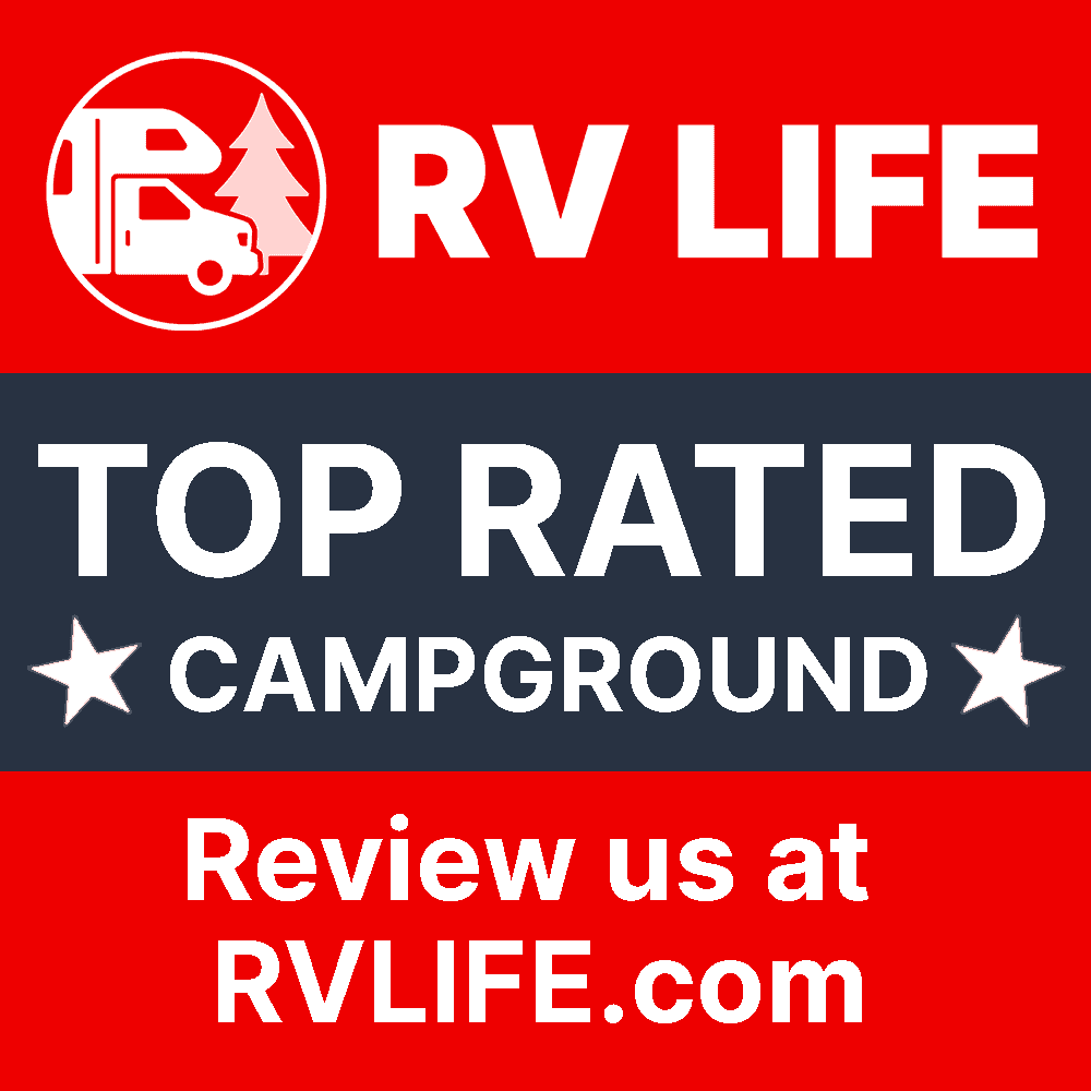Logo for "RV LIFE" featuring an RV icon and text "Top Rated Campground" with stars, inviting reviews at RVLIFE.com in the footer, in red, white, and blue colors.