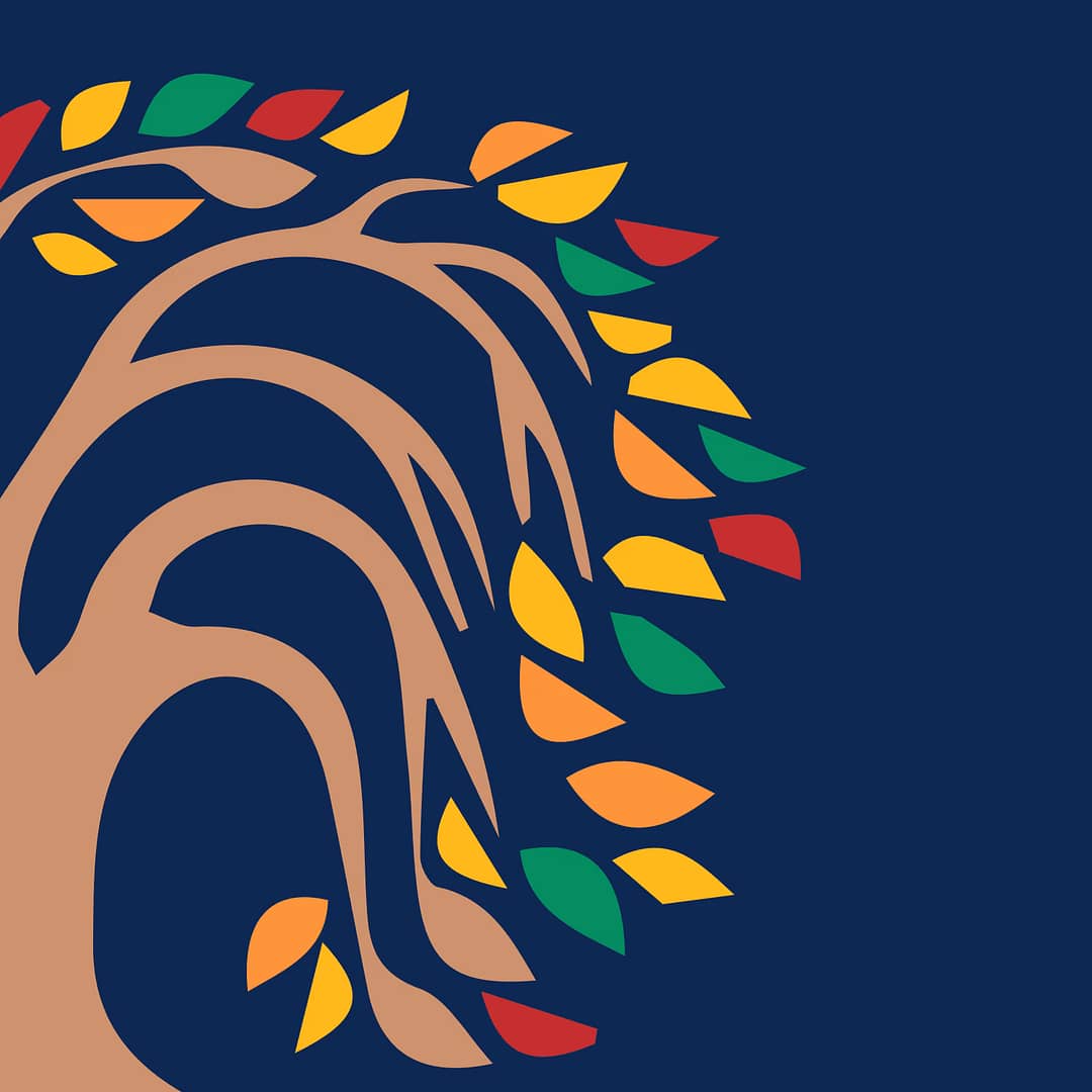 A tree with colorful leaves on a blue background is a visually stunning sight.