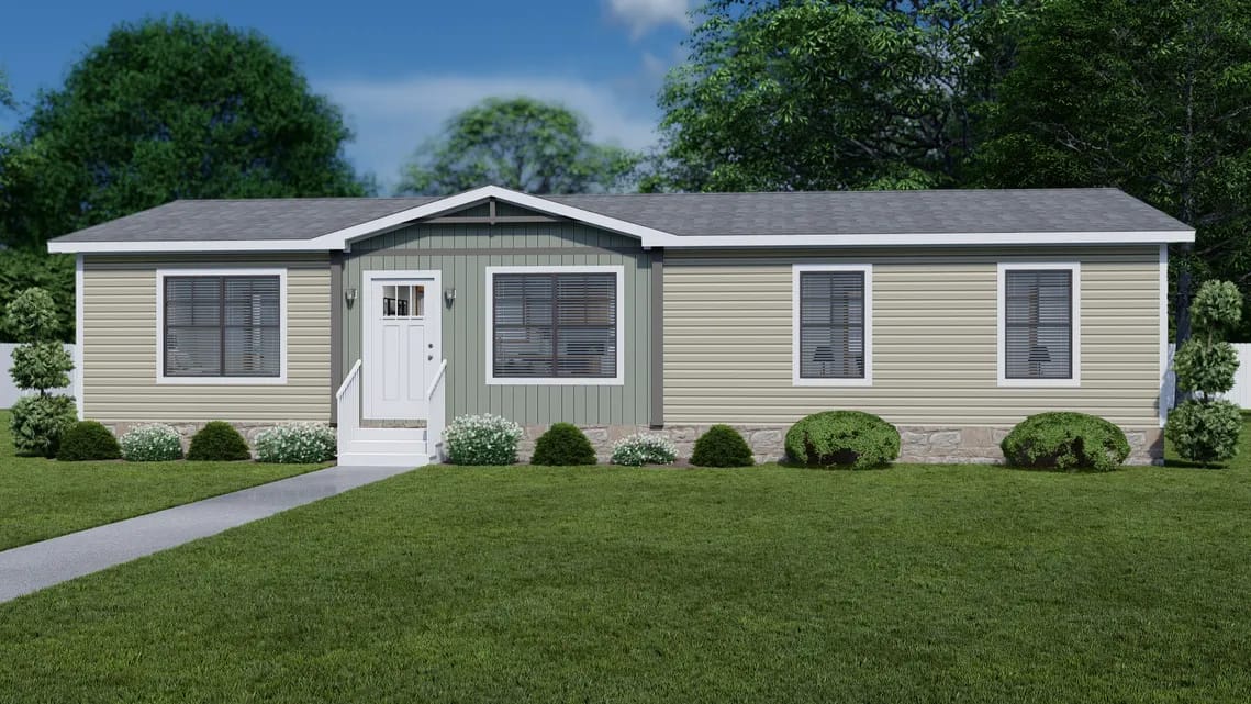 A single-story manufactured home with beige siding, white trim, and a gable roof surrounded by green lawn, shrubs, and trees.