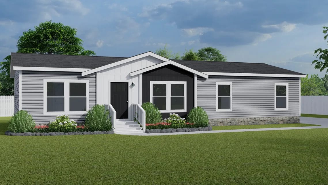 Single-story, gray manufactured home with black roof, white trim, a central entrance, steps with railings, and landscaped front yard.