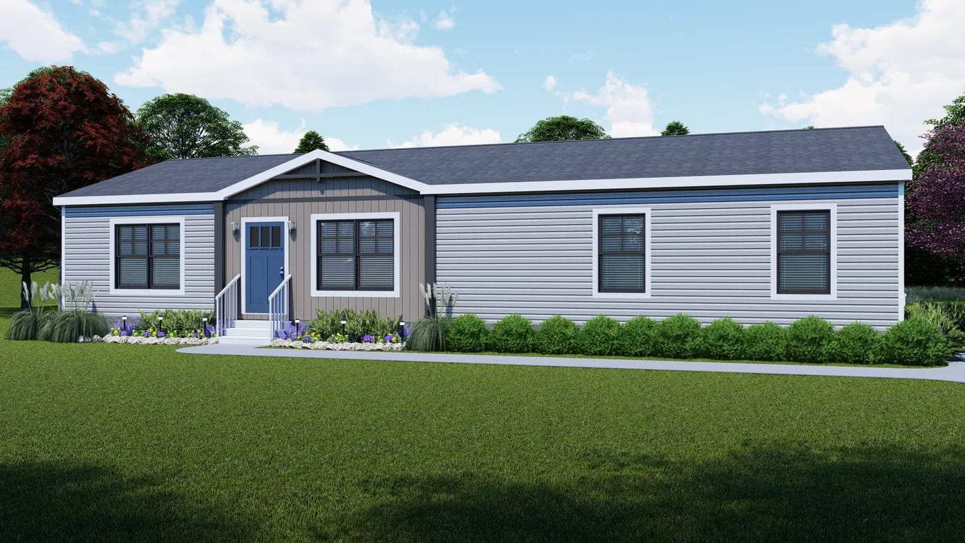 Single-story, gray manufactured home with a gabled roof, blue front door, white trim, small porch, and landscaped front yard on a sunny day.