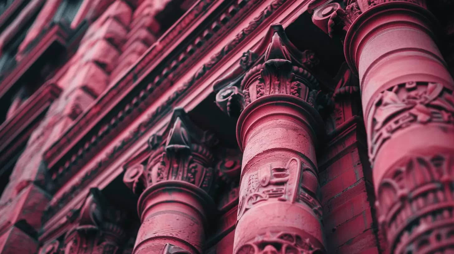 Deep rose-colored bricks with Renaissance Revival columns.