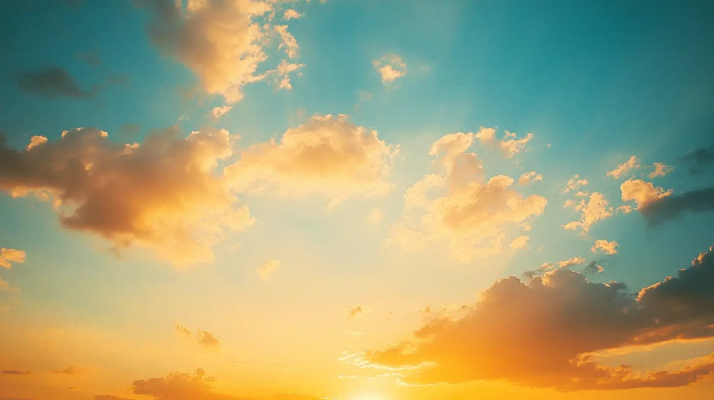 Golden sunset casting warm hues across clouds