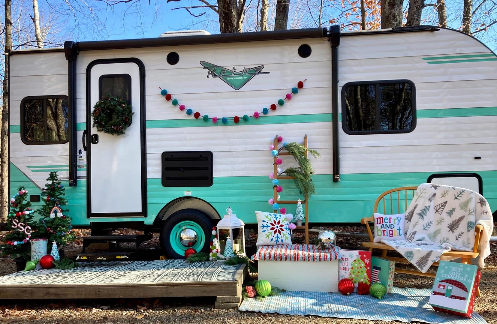 A holiday-themed trailer in the woods.