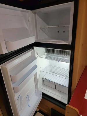 A refrigerator with shelves and shelves.