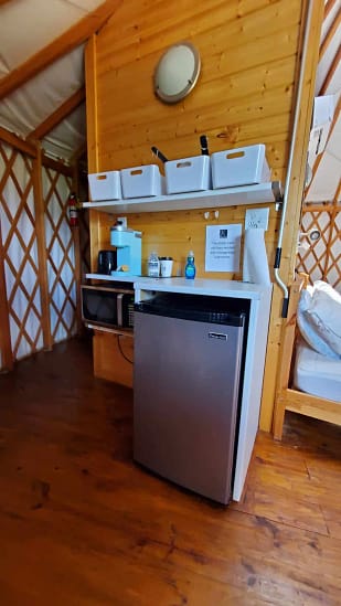 A small refrigerator in a room.