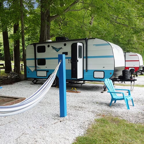 A group of campers parked in a park.