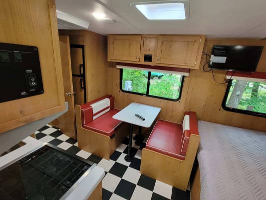 A table and chairs in a rv.