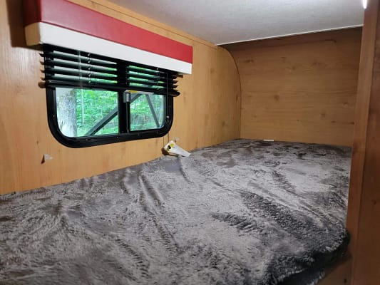 A bed in a trailer.