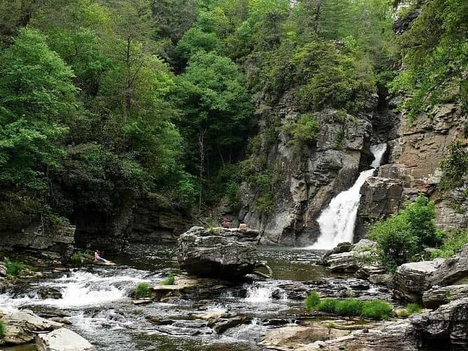 A waterfall in the midst of a Spring campground.