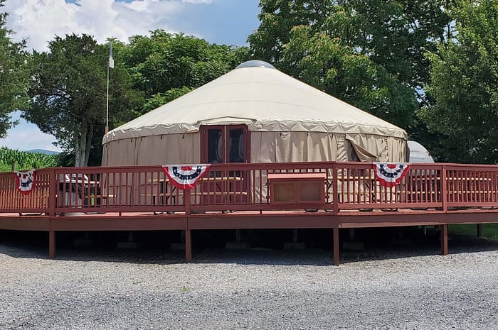 A tent on a deck.