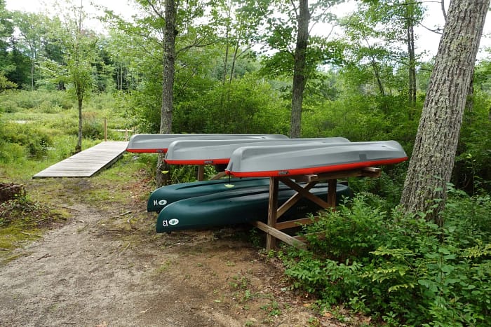 Canoe canoes on a rack.