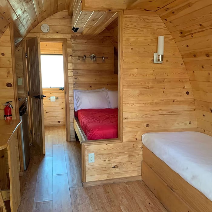A room with a bed and a table.