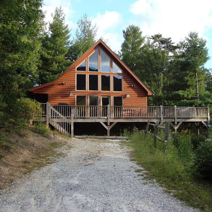 A house with a walkway leading to it.