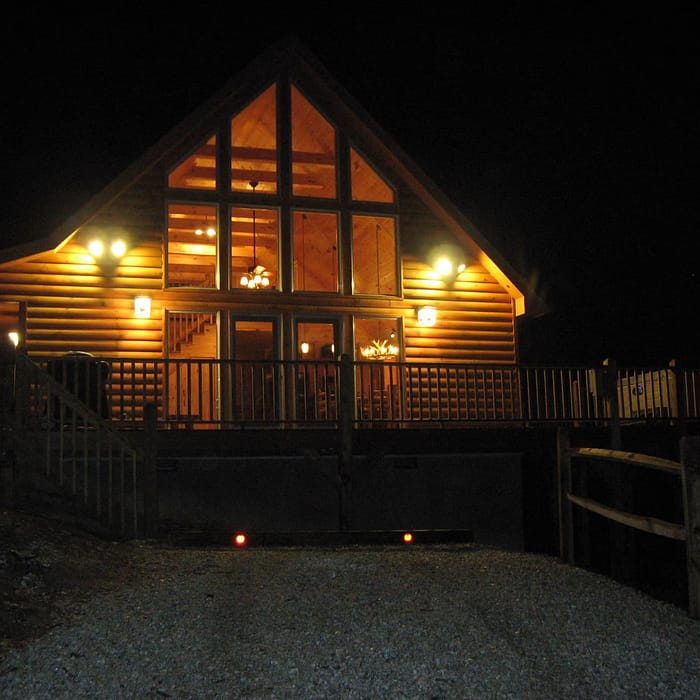 A house with a deck and a walkway.