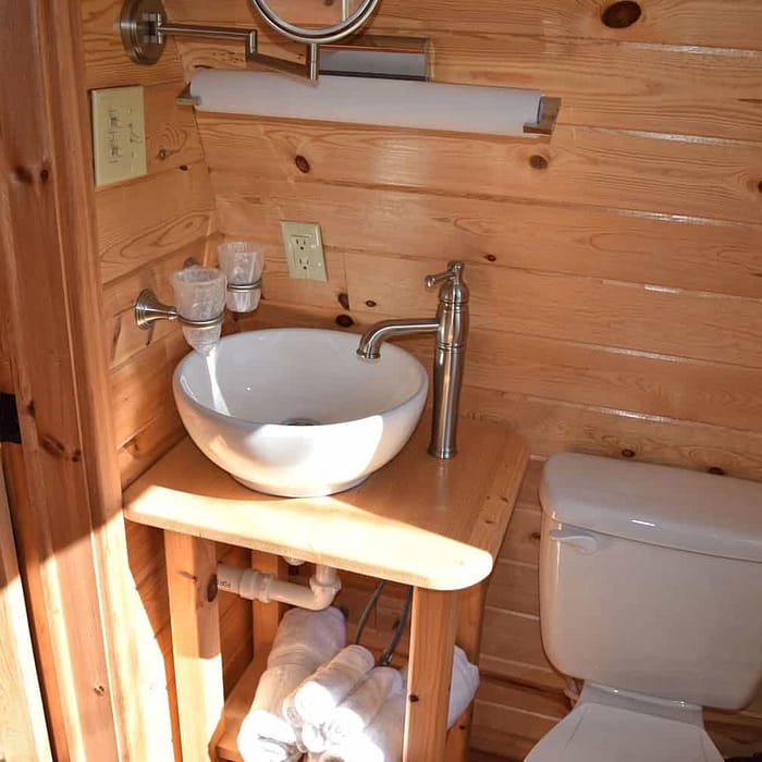 A bathroom with a sink and toilet.