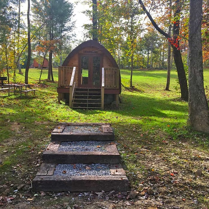 A small wooden structure in a park.