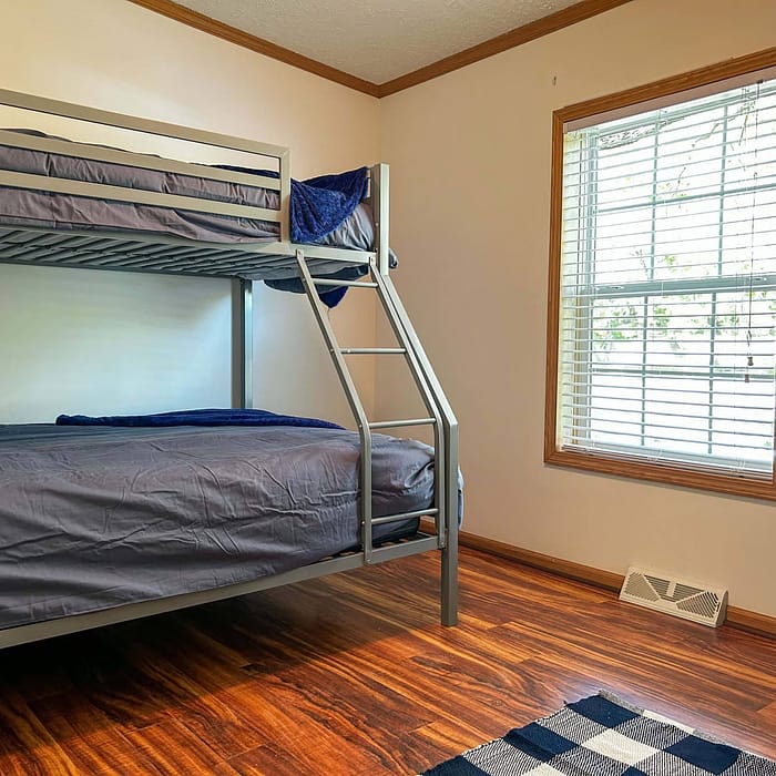 A bunk bed in a room.