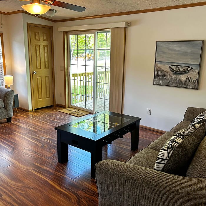 A living room with a couch and a coffee table.