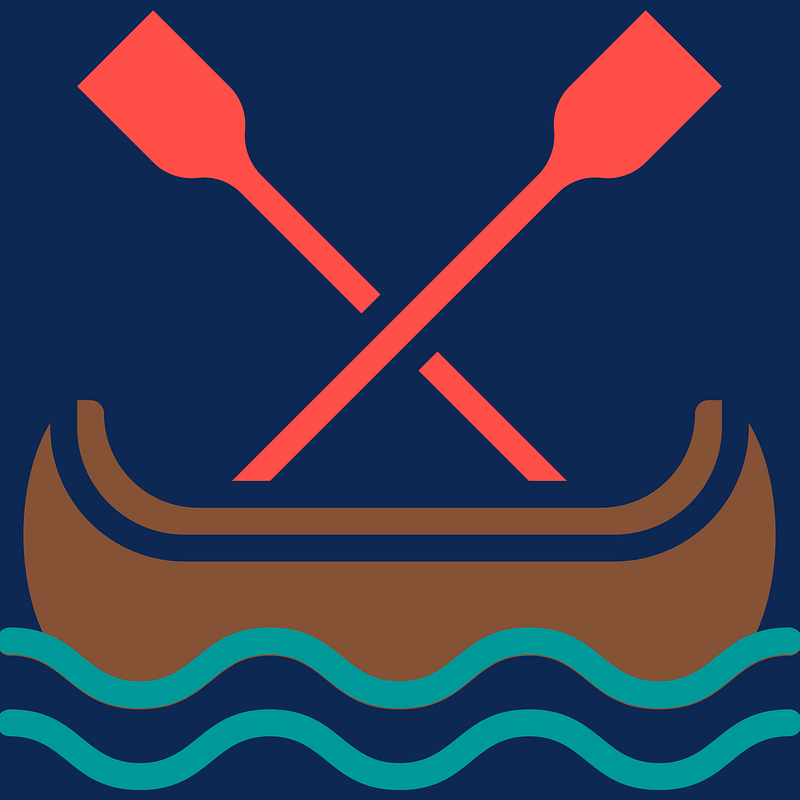 A canoe with two paddles on a serene pond.